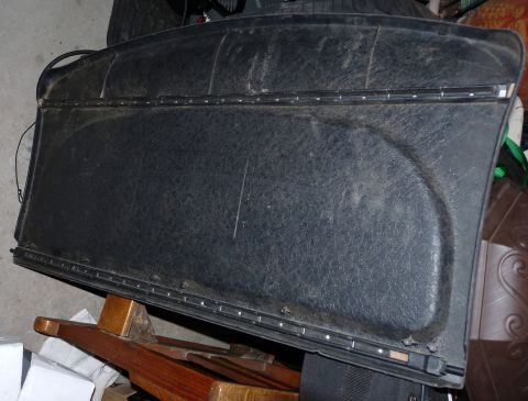 2006 Ford E350 - Black textured interior door panel with metal trim strip along the bottom edge.