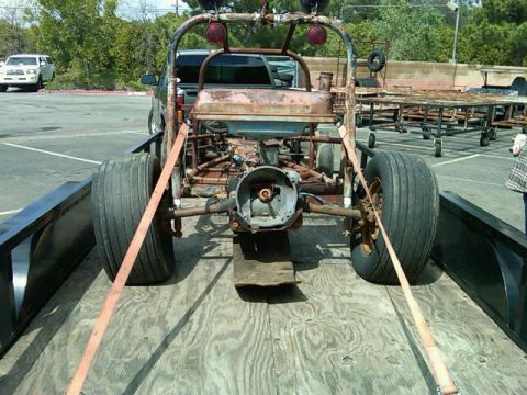 1995 Ford F-150 - Custom dune buggy project on a trailer, with a white SUV visible in the background.