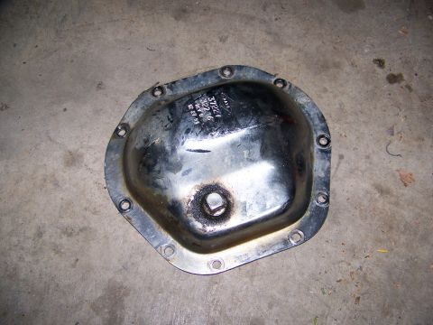 1992 Jeep YJ - A chrome differential cover is shown from above, resting on a concrete surface.