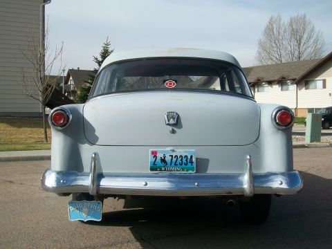 1952 Ford Mainline - This Ford sedan has a Wyoming license plate and a 'Road Devils' plate below the bumper.
