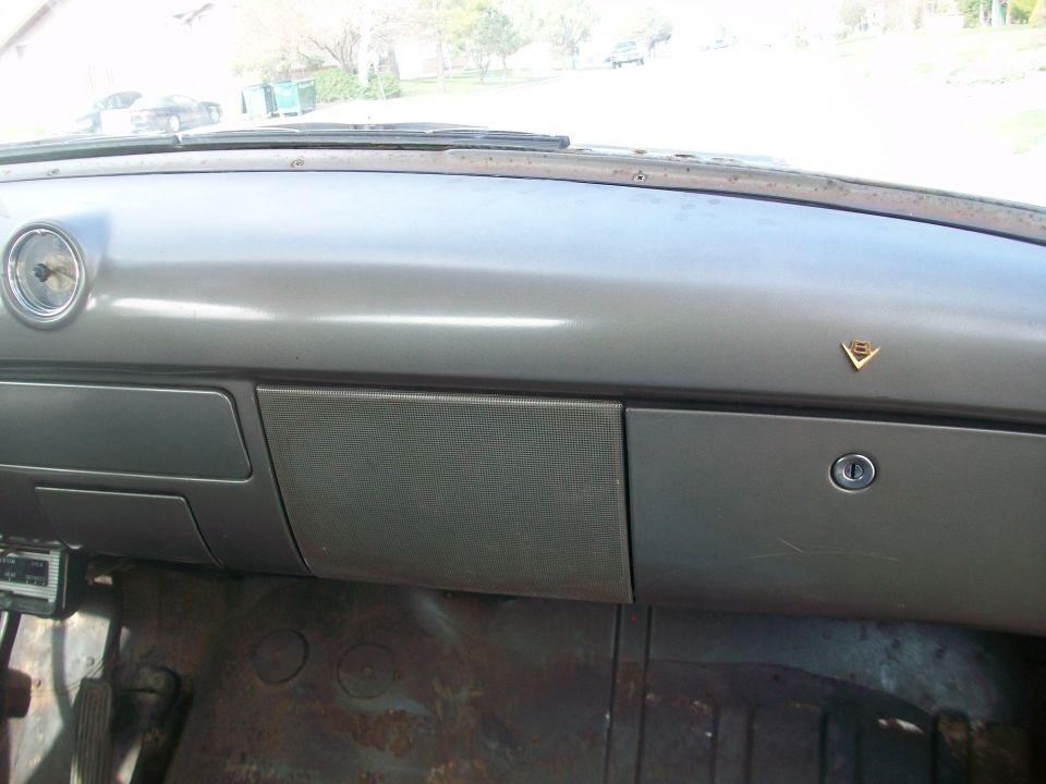 1952 Ford Mainline interior dashboard with round gauge and glove box
