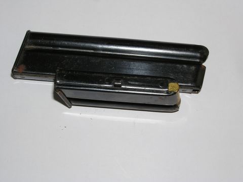 1900 Yugo GVX - Two black gun magazines are shown, one partially obscuring the other.