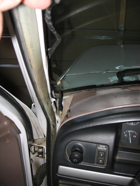 1995 Ford Bronco - after I dropped the plug through from above I had to fish it out down below. Pillar already has the holes for the push holders if you get a…