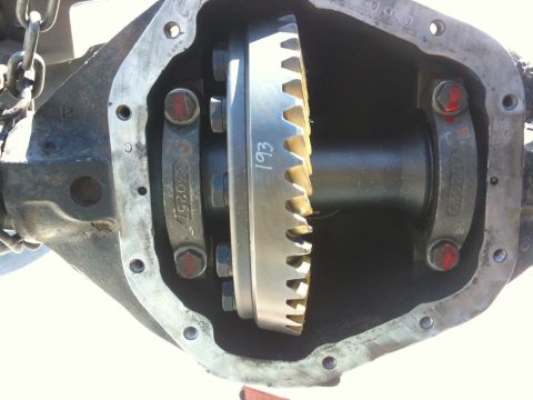 2009 Suzuki Samurai - Opened differential housing showing the ring gear and internal components. Part number 230257 is visible.