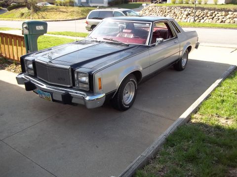 1970 Ford Ranchero - This Ford Thunderbird coupe has a two-tone silver and black paint scheme with a red interior.