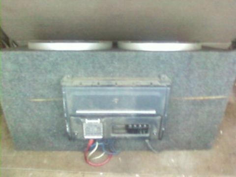 1995 Ford Bronco - Car stereo amplifier and subwoofer box with wiring visible.