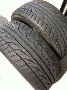 1993 Ford Probe - Close-up view of two stacked performance tires with visible tread detail.