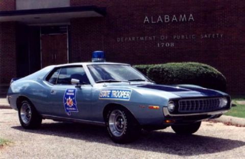 1991 Ford LTD Crown Victoria - Alabama State Trooper car, an AMC Matador, parked outside the Department of Public Safety building.