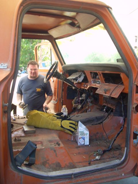 1992 Ford Ranger - The interior of a vintage truck is shown with the dashboard disassembled and wiring exposed.