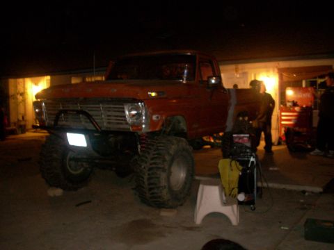 1992 Ford Ranger - A heavily modified pickup truck is parked in a garage at night, showing off its large tires and custom front end.