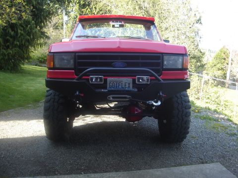 1989 Ford Bronco - This 1989 Ford Bronco features a custom front bumper with a winch and an ARB visor.