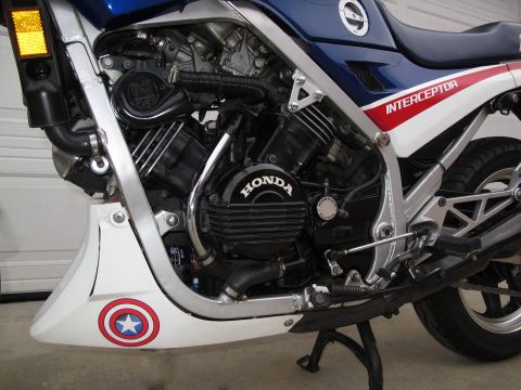 1984 Honda Interceptor - The engine of a Honda motorcycle is shown, the 'Honda' logo and 'Interceptor' branding on the bodywork.
