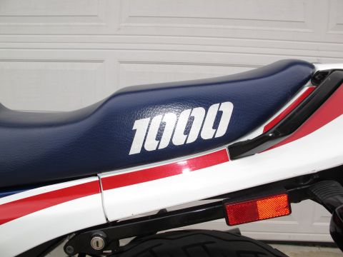1984 Honda Interceptor - Motorcycle seat detail showing the '1000' designation and red/white livery.