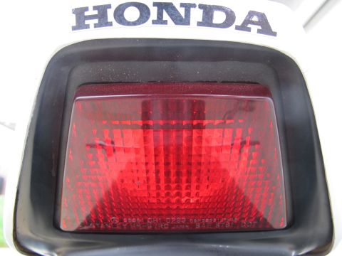 1984 Honda Interceptor - The rear tail light assembly of a Honda motorcycle is shown, with the brand name visible above.