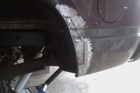 1994 Chevrolet Blazer - Rust repair in progress on the rear quarter panel of a 1994 Chevrolet Blazer.