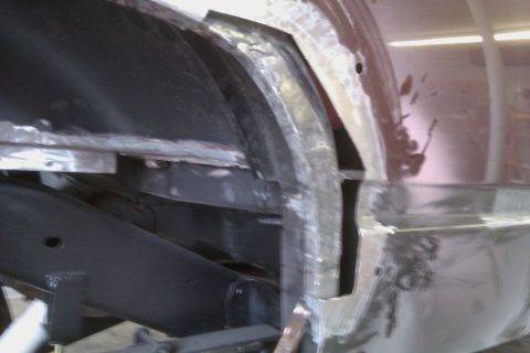 1994 Chevrolet Blazer - This image shows extensive rust and repair work on a vehicle's wheel well and frame, indicating significant body damage.
