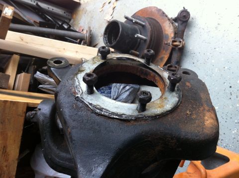 1996 Ford Bronco - Close-up of a rusty Dana 60 axle housing, likely from an older truck or SUV.