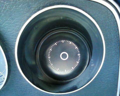 1976 Ford Torino - A close-up view of a vehicle's interior shows a gauge with white markings on a black background.