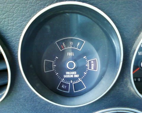 1976 Ford Torino - The fuel gauge shows the tank is empty, with a warning for unleaded gasoline only.