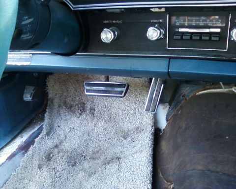 1976 Ford Torino - Interior view of a 1976 Ford Torino, highlighting the pedal assembly and dashboard controls.