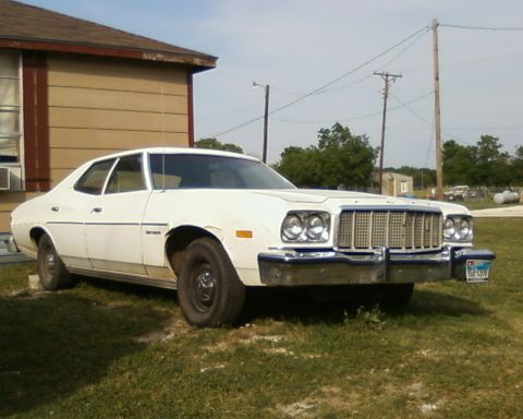 1976 Ford Torino - White 1976 Ford Torino sedan parked outdoors on a sunny day.
