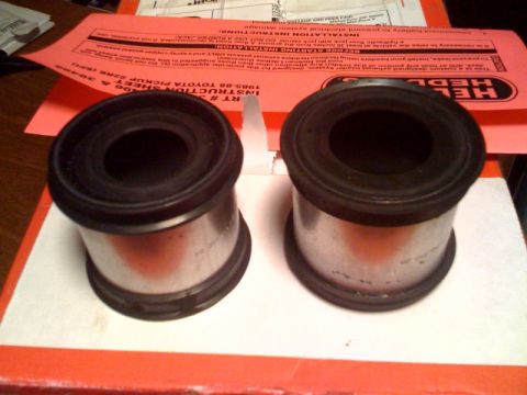 1982 Ford F-100 - Two suspension bushings are shown with an instruction sheet for a 1985-88 Toyota Pickup.