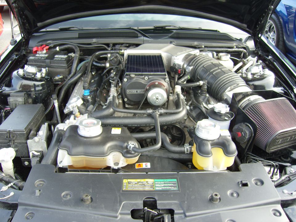 2007 Ford Mustang engine bay with Kenne Bell supercharger and custom air intake