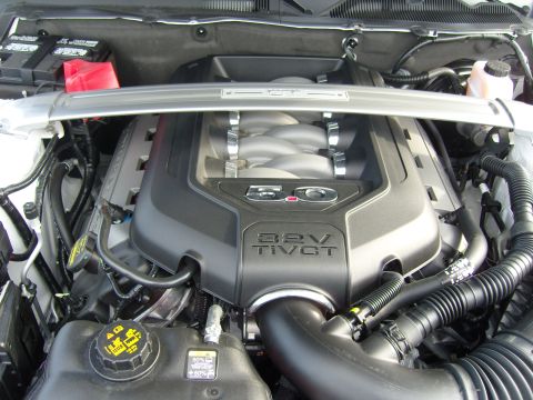 2007 Ford Mustang - Close-up of a Ford 5.0L Ti-VCT engine, likely from a Mustang GT.