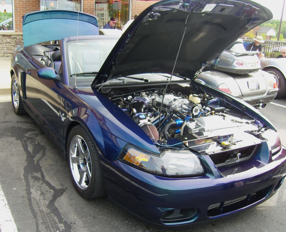 Blue 2007 Ford Mustang convertible with hood open, showing engine and supercharger