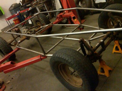 1995 Ford F-150 - A custom tube chassis buggy project is shown in a workshop setting with suspension components visible.