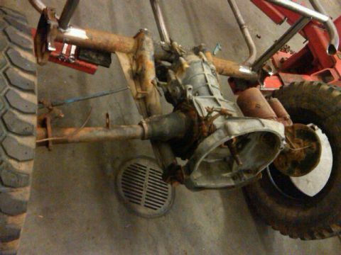 1995 Ford F-150 - Custom buggy chassis with transmission and large tire, appears to be under construction.