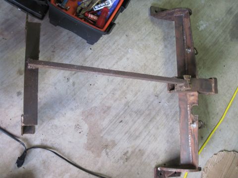 1979 Ford Bronco - A custom-fabricated metal part is shown, with a toolbox and tools visible in the background.
