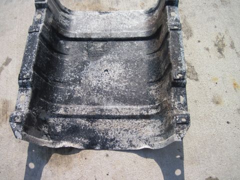 1979 Ford Bronco - This is a metal part with mounting tabs, likely a heat shield or bracket.