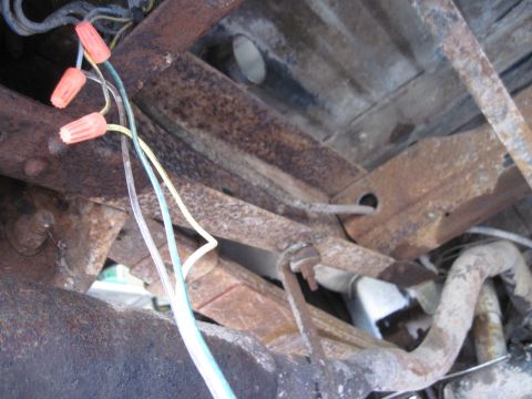 1979 Ford Bronco - Close-up view of the undercarriage, showing wiring and orange wire nuts.