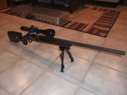 1996 Ford Bronco - A sniper rifle with a scope and bipod is displayed on a tiled floor.