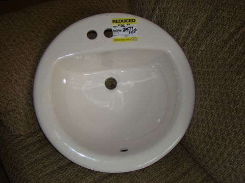 1970 Mercury Cougar - A white sink is shown with two yellow price tags indicating a reduced price.