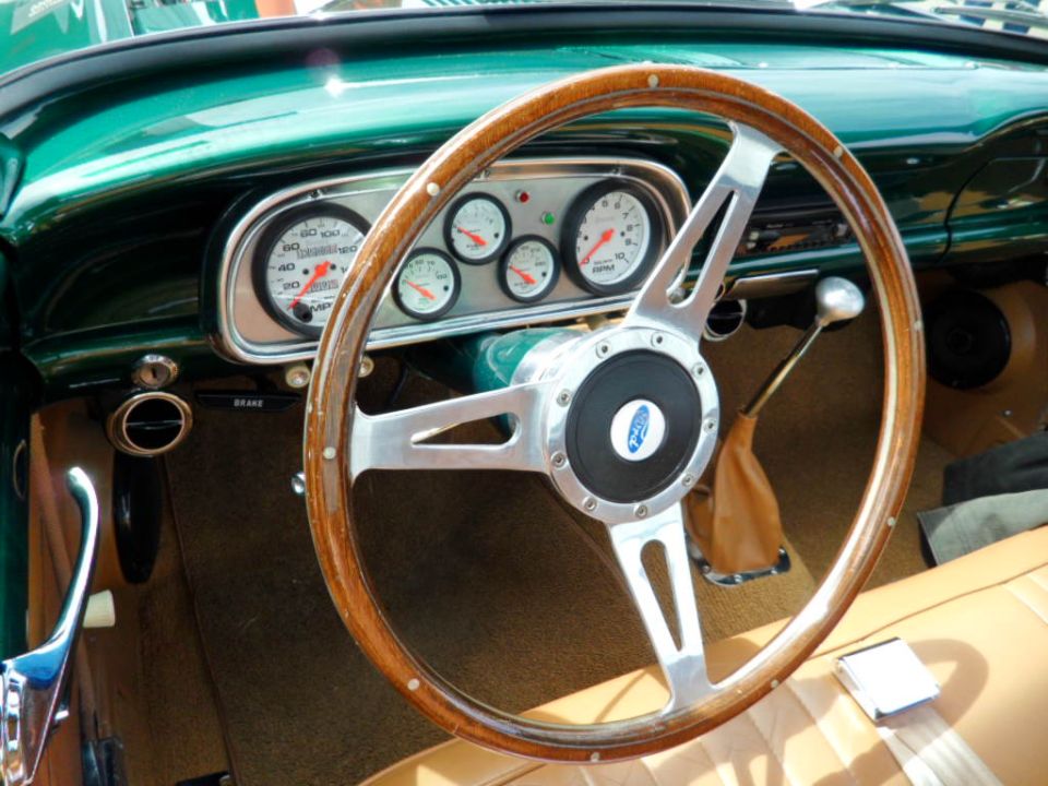 1956 Ford Fairlane interior with wood steering wheel and custom gauges