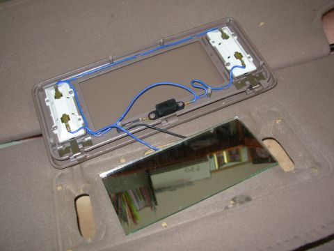 1983 Ford Bronco - Removing the stamped nuts allows the vanity assembly to be lifted from the visor, but the riveted wiring prevents them from being totally s…