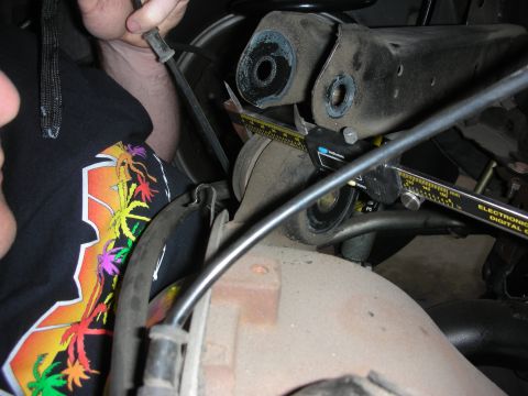1998 Ford Crown Victoria - Measuring suspension component with a digital caliper.