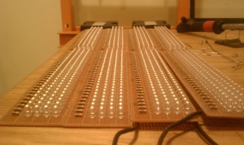 1990 Ford Bronco - Circuit boards for an LED light bar are laid out on a wooden surface, showing numerous LEDs and resistors.