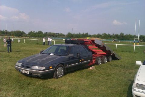 1991 Ford Crown Victoria - Citroën XM sedan with a trailer attached, parked on a grassy field near a track.