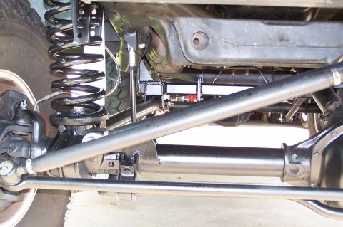 2000 Ford F-150 - Close-up view of the vehicle's undercarriage, highlighting its suspension and drivetrain components.