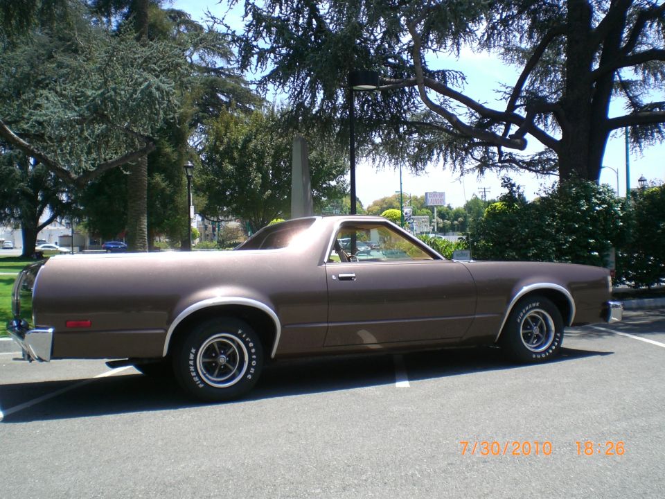 Brown 1979 Ford Ranchero parked on asphalt, side view