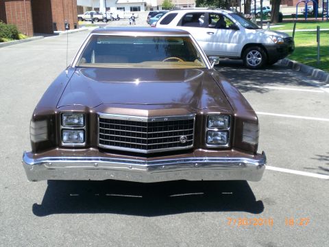 1979 Ford Ranchero - Front view of a brown 1977 Ford sedan with a prominent chrome grille and dual headlights.