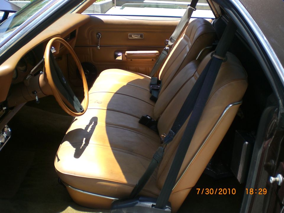 1979 Ford Ranchero interior showing tan vinyl seats, dashboard, and steering wheel