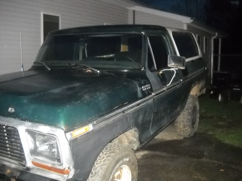 1993 Ford F-150 - This 1978 Ford Bronco is shown from the front 3/4 angle, displaying its green paint and white top.