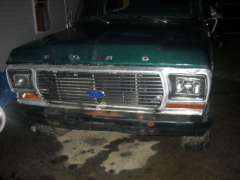 1993 Ford F-150 - Front view of a green 1993 Ford F-150 pickup truck a prominent chrome grille and Ford badging.