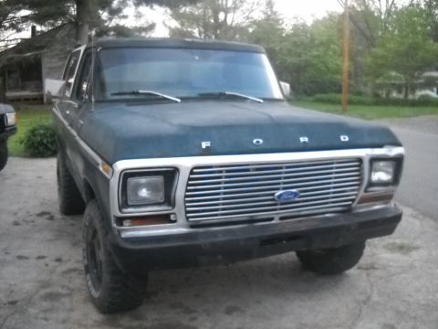 1993 Ford F-150 - Front view of a dark blue Ford truck with a chrome grille and "FORD" lettering on the hood.