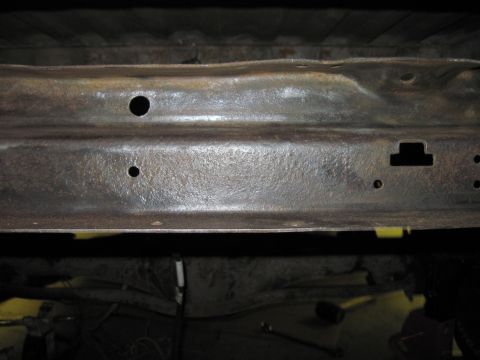 1979 Ford Bronco - Close-up of a rusty underbody frame, with the Supermotors.net logo in the lower right corner.
