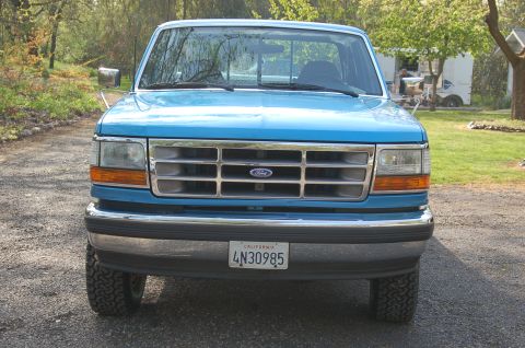 1992 Ford F-150 - Front view of a blue 1992 Ford F-150 pickup truck parked outdoors.